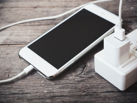 Smartphone charger with plug and socketの写真素材