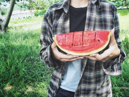 Woman eating watermelonの写真素材