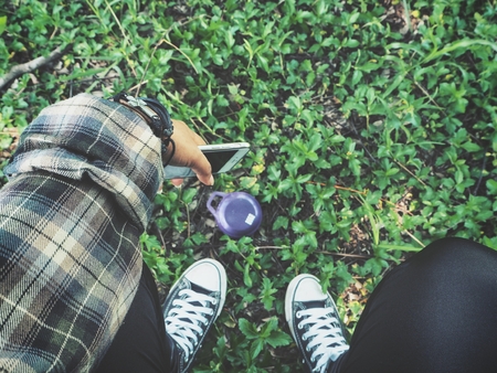 Woman using  speaker with smart phoneの写真素材