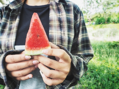 Woman eating watermelonの写真素材