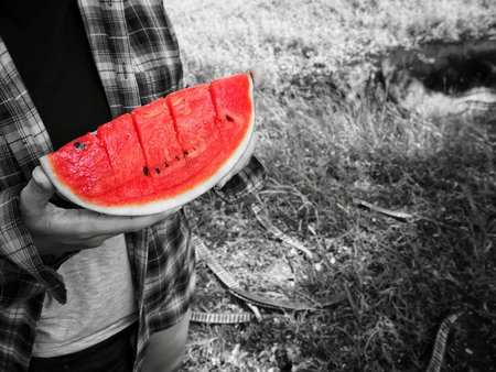 Woman eating watermelonの写真素材