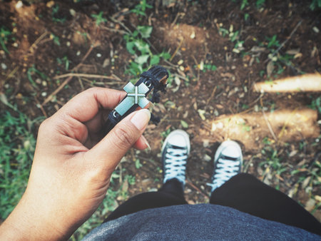 Cross on hand