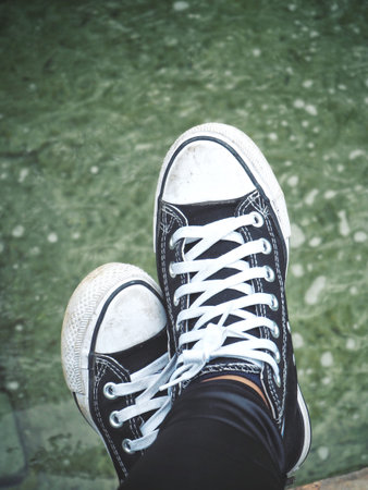 Selfie of sneakers with water