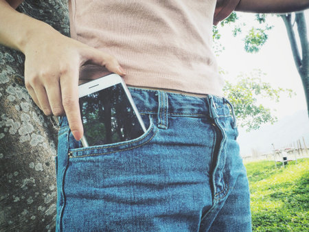 Smart phone in jeans pocket