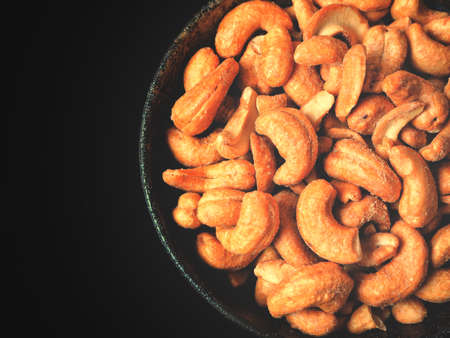Cashew nuts on black backgroundの写真素材