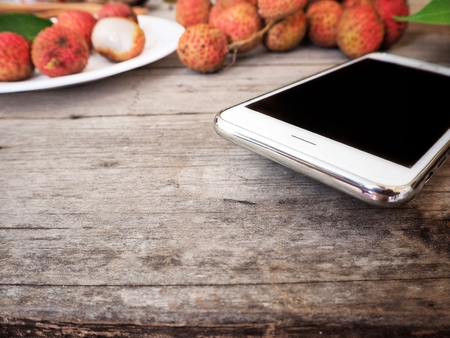 lychee with smart phoneの写真素材