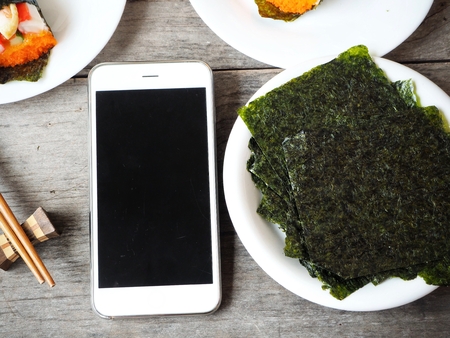 Korean seaweed with sushi and smart phoneの写真素材