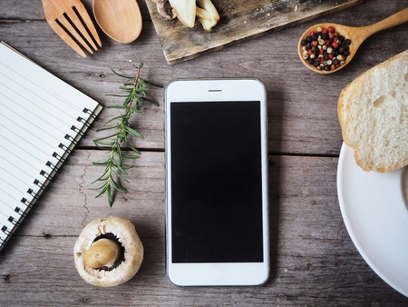 Creamy mushroom soup with smart phoneの写真素材