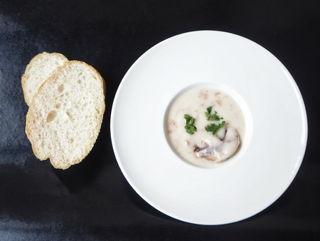 Creamy mushroom soup on black backgroundの写真素材