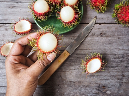 Rambutan fruit on handの写真素材