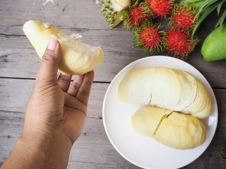 Tropical fruit of durian rambutan mango and pineappleの写真素材