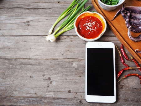 Korean red pepper paste gochujang with smart phoneの写真素材