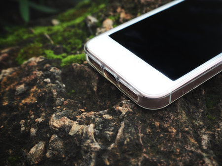 Smart phone on stoneの写真素材