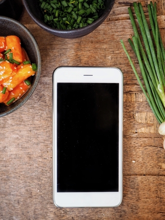 Rice cake korean food with smart phoneの写真素材