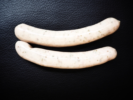 White sausage on black backgroundの写真素材