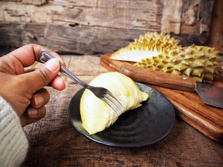 Woman eating durianの写真素材