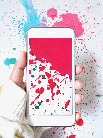 Taking a photo of watercolor on paper with smart phoneの写真素材