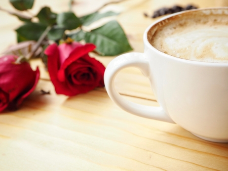 Coffee with milk and red rose in valentines dayの写真素材