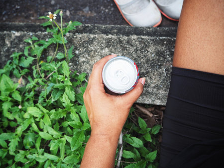Woman drinking cola canの写真素材
