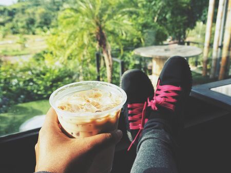 Selfie of iced coffee on handの写真素材