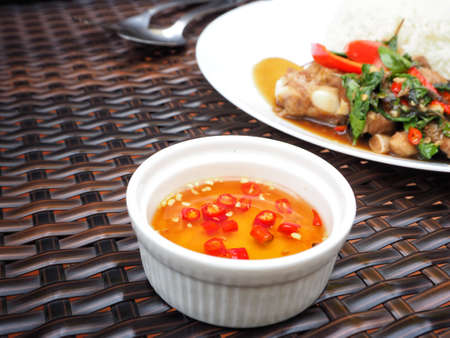 Thai basil pork with rice and fish sauceの写真素材