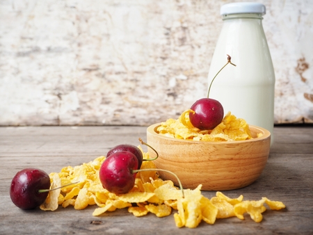 Corn flakes and cherry with milkの写真素材