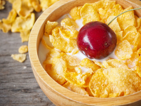 Corn flakes and cherry with milk
