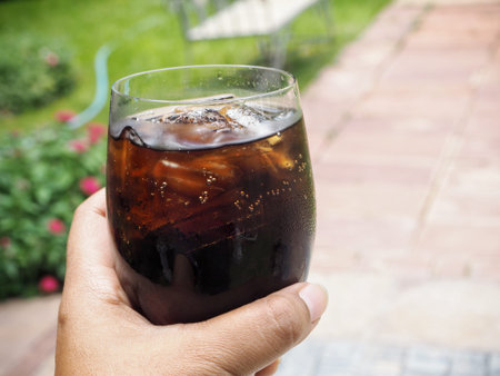 Cola with ice cubes