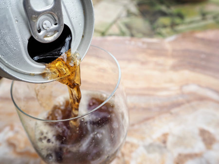 Woman pouring cola drink