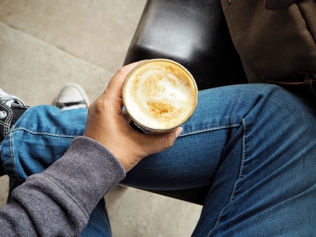 Woman drinking coffee cupの写真素材
