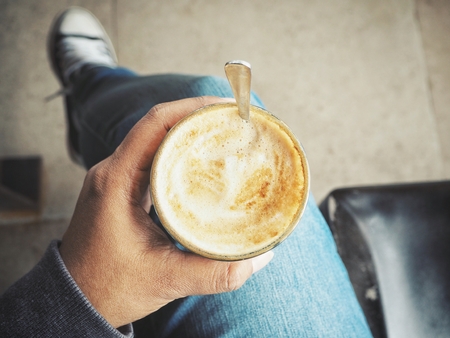 Woman drinking coffee cupの写真素材