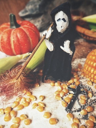 Halloween wood doll with dried cornsの写真素材
