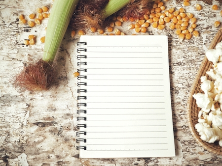 Popcorn with blank notepadの写真素材