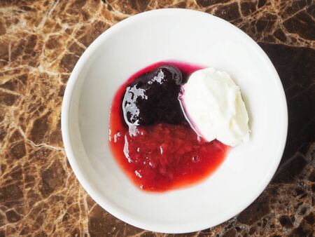 Strawberry and blueberry jam with cream cheeseの写真素材