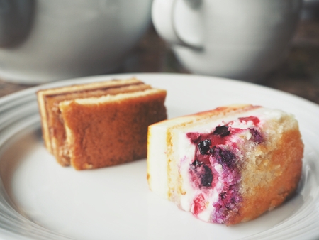 Fruits and coffee cake with tea cupの写真素材