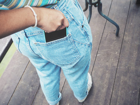 Smart phone in jeans pocket