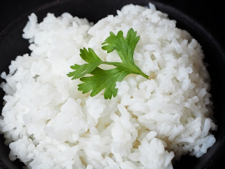 Cooked rice on black backgroundの写真素材