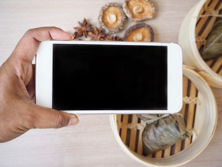 Smart phone with zongziの写真素材