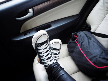 Selfie of sneakers with bag on the car