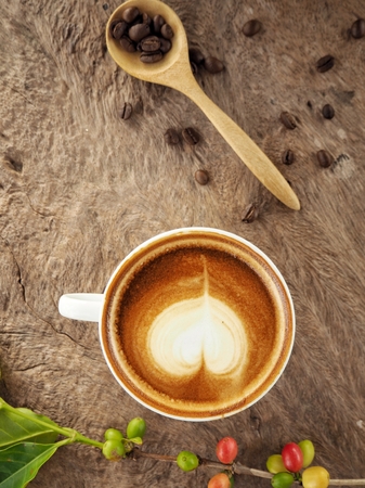 Latte art coffee with beansの写真素材