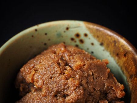 Miso paste on black background