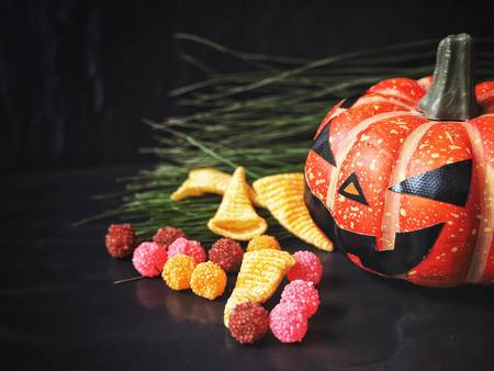 Halloween pumpkin with snackの写真素材