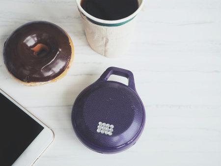 Bluetooth speaker with smart phone and coffee cupの写真素材