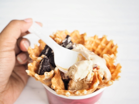 Woman eating ice cream coffeeの写真素材