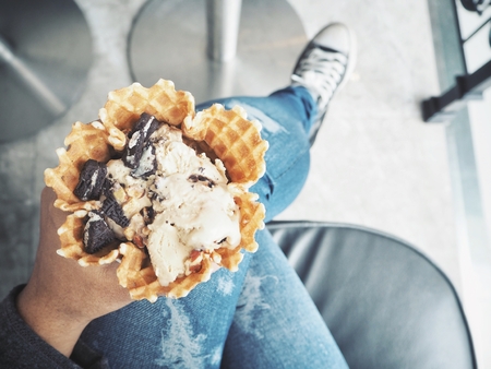 Woman eating ice cream coffeeの写真素材