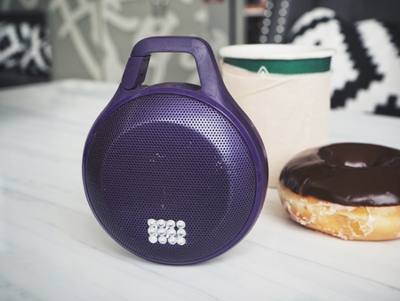 Bluetooth speaker with coffee cup and donutの写真素材