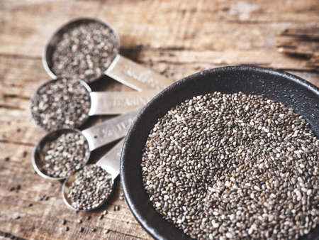 Chia seeds with spoonsの写真素材