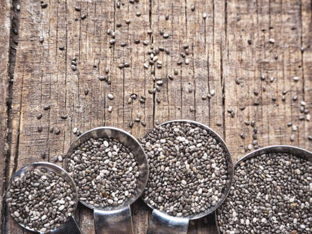 Chia seeds with spoonsの写真素材