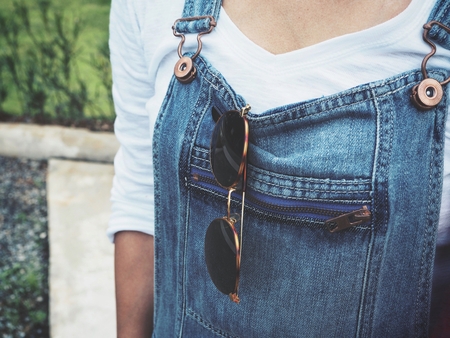 Woman and sun glasses with jeansの写真素材
