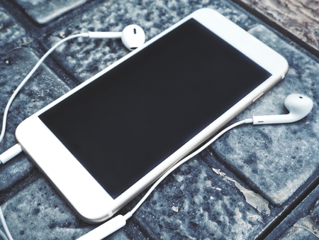 Smart phone with headphonesの写真素材
